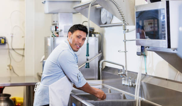 asian man wahing hand in kitchen https://skillmastertc.com/